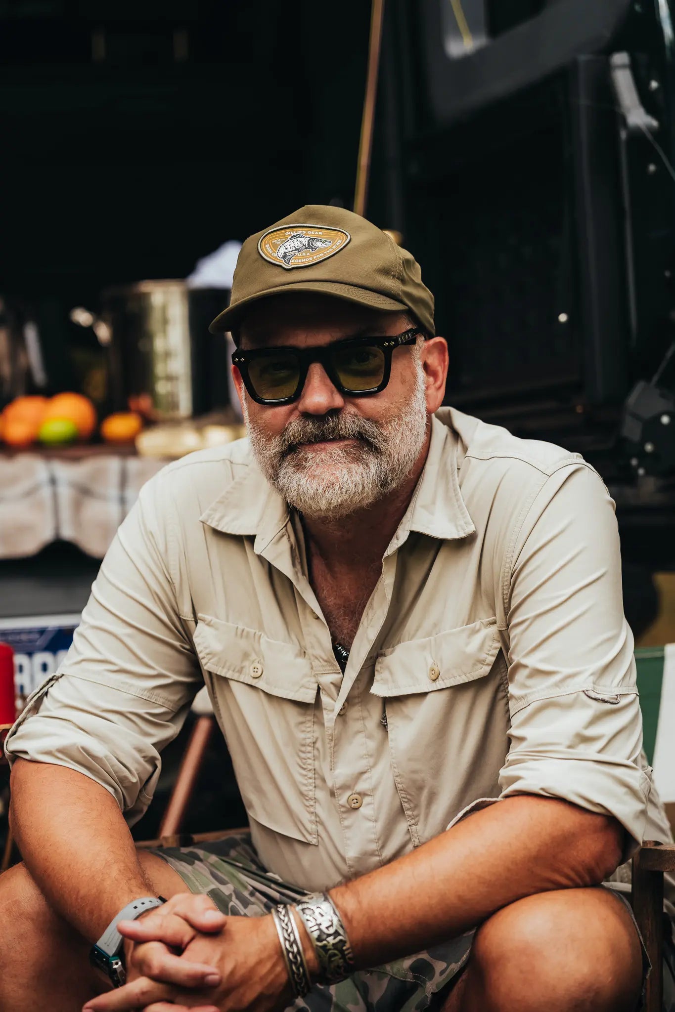 Bearded angler in an olive Gillies cap and sunglasses